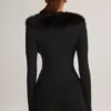 Nesta korsettplaysuit med fuskpälskant i svart