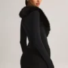 Nesta korsettplaysuit med fuskpälskant i svart
