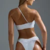 Oh Polly Badkläder: HOTFIX Edition Bandeau-bikinitopp med en axel och dekorationer i vitt