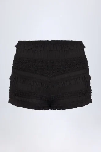Orla Shorts med volanger och medelhög midja i svart