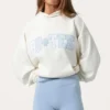 Oversized hoodie med applikation i färgen Milk