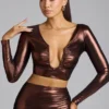 Rana crop top i metalliskt jersey med djup urringning i kopparbrons