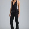 Reese Metallic Ruffle Low-Rise Flared Trousers i svart