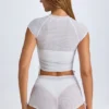 Rocas genomskinliga, rynkade minishorts i vitt