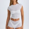 Rocas genomskinliga, rynkade minishorts i vitt