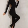 Rumer jumpsuit med hög hals och öppen rygg i svart