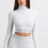 Rygglös långärmad crop top med hög hals i gråmelerad