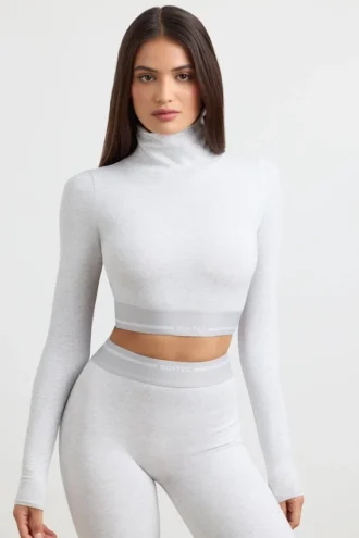 Rygglös långärmad crop top med hög hals i gråmelerad
