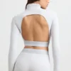 Rygglös långärmad crop top med hög hals i gråmelerad