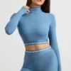 Rygglös långärmad crop top med hög hals i stålblått