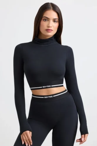 Rygglös långärmad crop top med turtleneck i svart