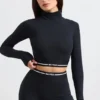 Rygglös långärmad crop top med turtleneck i svart
