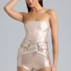 Sasha metallic-denim-korsettplaysuit med bälte i champagne