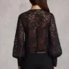 Serenya genomskinlig spets-playsuit med djup urringning och lös passform i svart