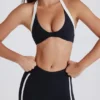 Soft Active sport-BH med vridet framsida och halterneck i svart