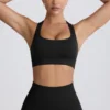 Super Sculpt sömlös sport-BH med T-rygg i svart