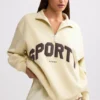 Sweatshirt med kvartslås i benvit