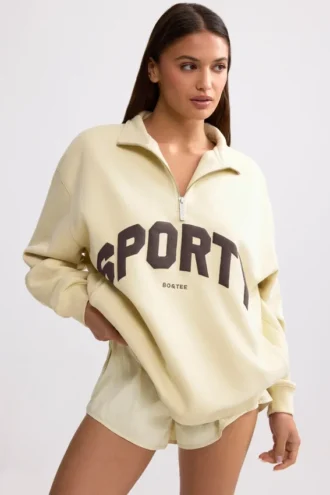 Sweatshirt med kvartslås i benvit