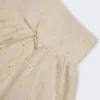 Thia minikjol med rosettdetalj i broderie anglaise i elfenben