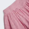 Thia minikjol med rosettdetaljer i broderie anglaise i mjukrosa