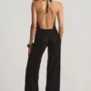 Tulay Devoré jumpsuit med halterneck och öppen rygg i svart