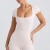 Unitard med rund halsringning i tvättad krämfärg