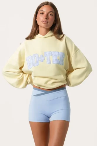 Överdimensionerad hoodie med applikation i citrongult