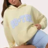 Överdimensionerad hoodie med applikation i citrongult