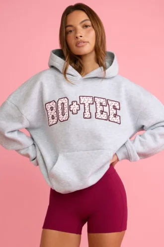 Överdimensionerad hoodie med applikation i grått