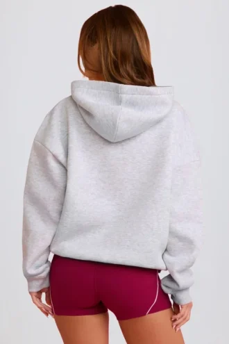 Överdimensionerad hoodie med applikation i grått