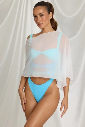 Zarayah genomskinlig poncho i vitt