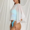 Zarayah genomskinlig poncho i vitt