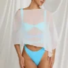 Zarayah genomskinlig poncho i vitt