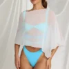 Zarayah genomskinlig poncho i vitt